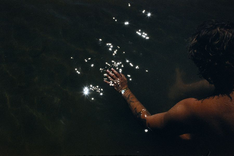 Boy's Hand In The Water